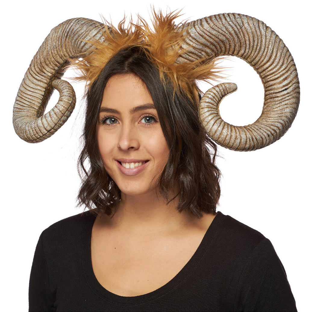 Portrait of woman wearing Bighorn sheep curled horns